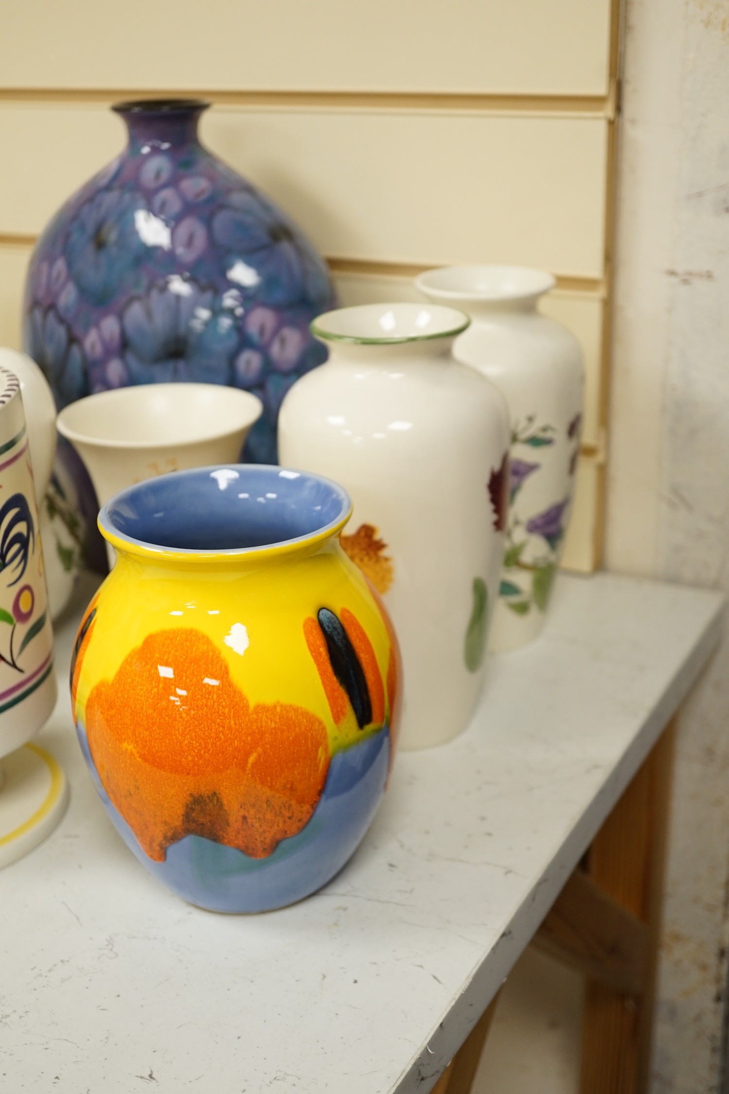 A collection of Poole pottery jugs and vases. Tallest 29cm